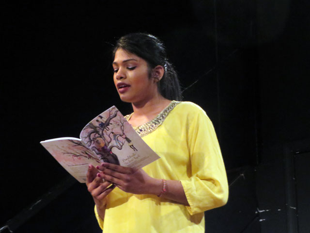 Pomegranate Tree Group performer Chenthoori reads an excerpt from the comic book "Heartbeats: The IZZAT Project" at Busboys and Poets in Washington, DC.