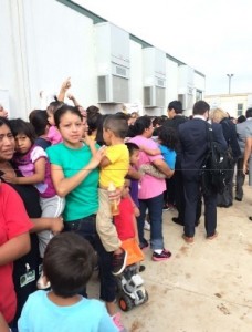 Mothers and children in detention in Texas assemble to greet members of Congress.