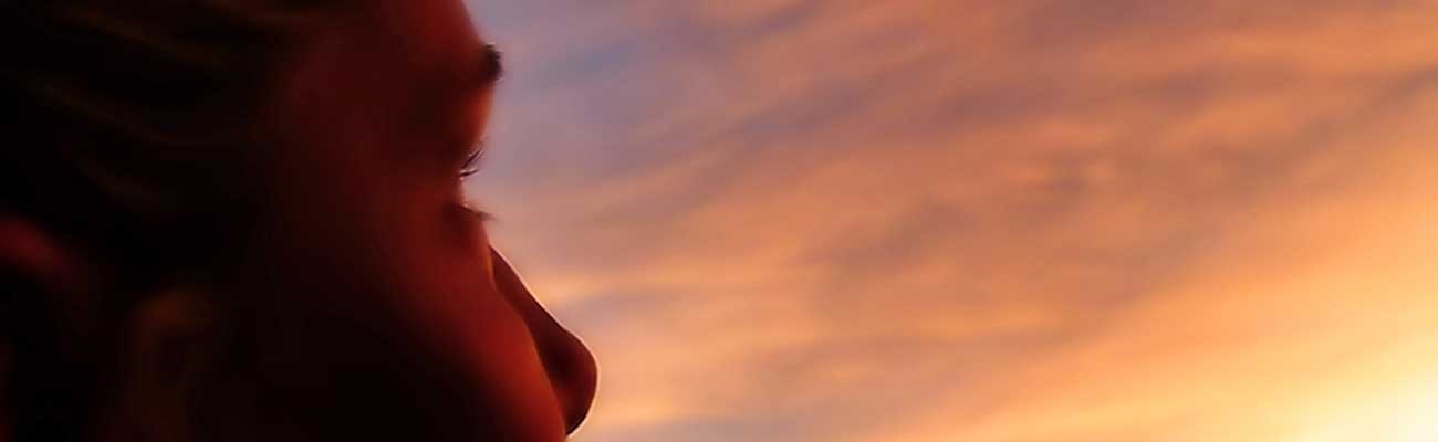 Profile-of-Happy-Woman-in-Sunset-Banner