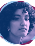 Woman of Persian descent looking at the camera with a strong, thoughtful expression