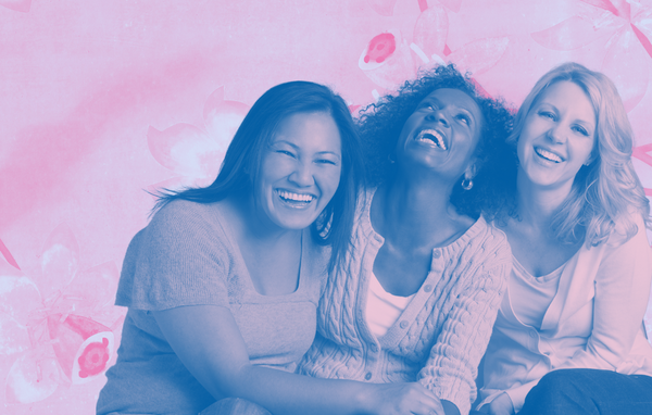 Three laughing, smiling women.