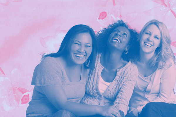 Three laughing, smiling women.