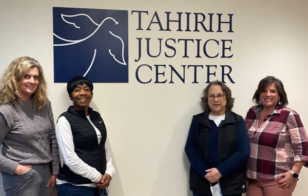 Marlo Goldstein (pictured far left) and the Host Hotels team at Tahirih's GDC office.