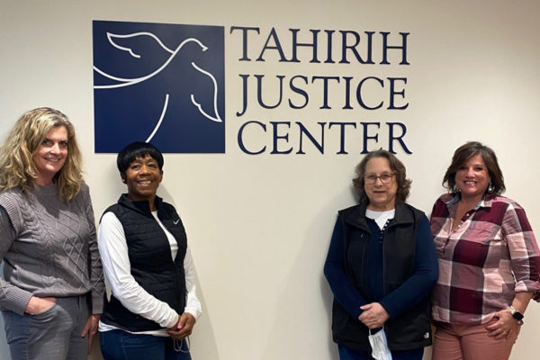 Marlo Goldstein (pictured far left) and the Host Hotels team at Tahirih's GDC office.