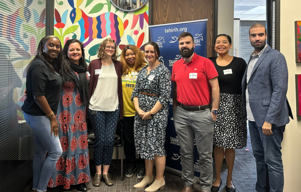 Young Professionals Network members and Tahirih staff smiling together