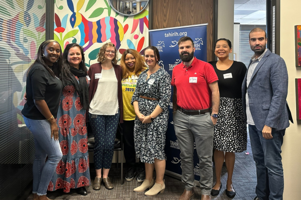 Young Professionals Network members and Tahirih staff smiling together