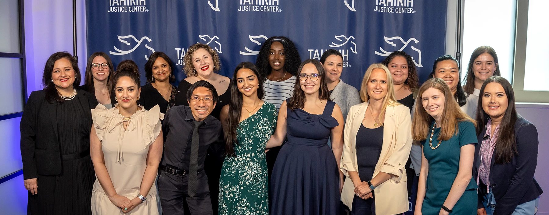 Group photo of smiling staff members