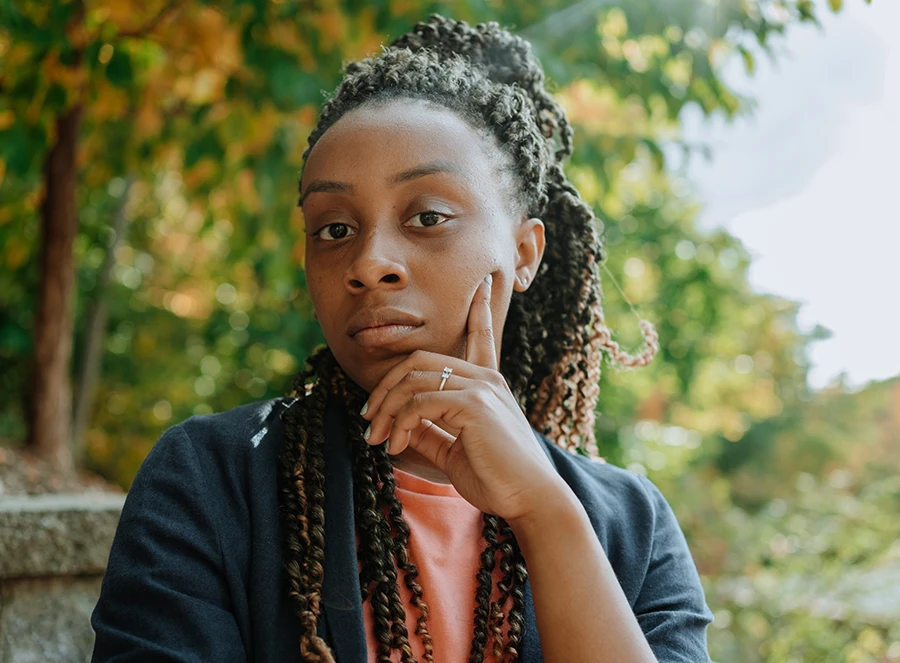 Young Black woman with thoughtful expression