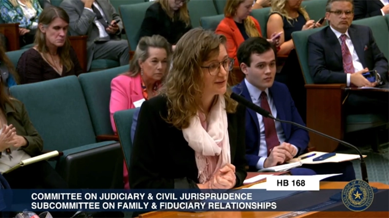 Woman speaking at a hearing
