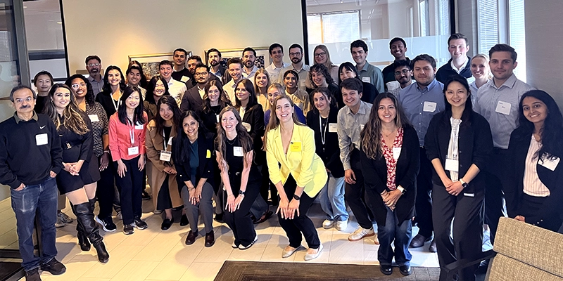 Group of professional people in a conference room smiling